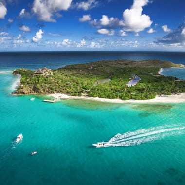 An aerial view of Necker Island surrounded by turquoise waters in the British Virgin Islands.