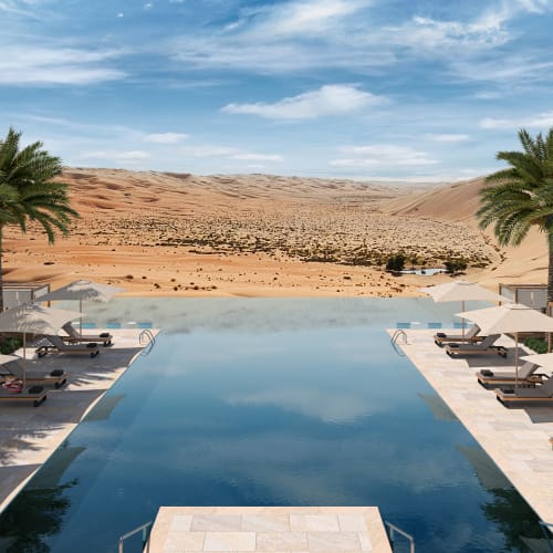 A luxurious desert resort with an infinity pool, surrounded by lounge chairs and palm trees, set against a vast desert landscape.