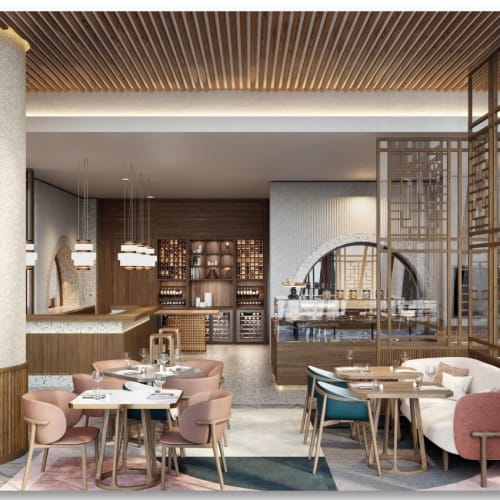The interior of Mandarin Oriental Downtown Dubai featuring elegant seating areas with pastel chairs and modern decor.