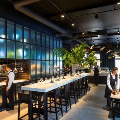 Interior of a modern brasserie restaurant with a buffet and seating area in Rovinj, Croatia.