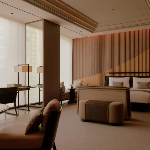 Luxurious hotel suite with a large bed, modern decor, and floor-to-ceiling windows allowing natural light.