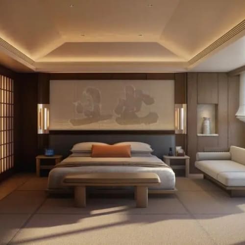 A minimalist bedroom with a large bed, a sofa, and soft lighting in a modern hotel room.