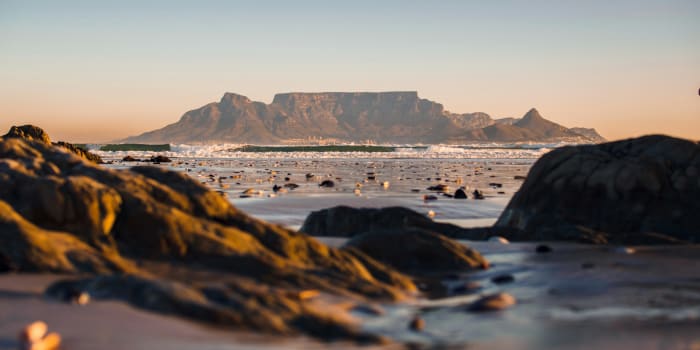 Stones with the sea and Table Mountain in the background