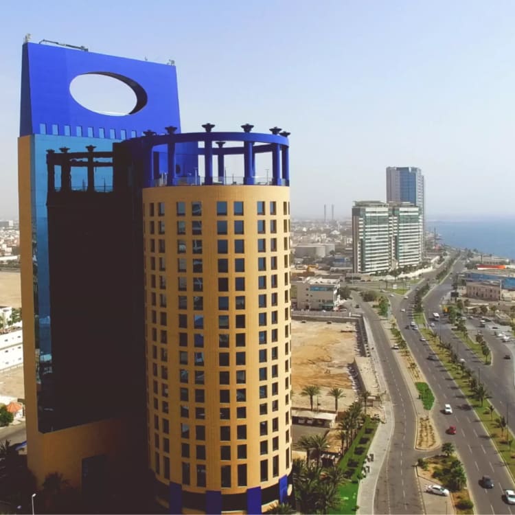 an aerial view of the Rosewood hotel near the ocean