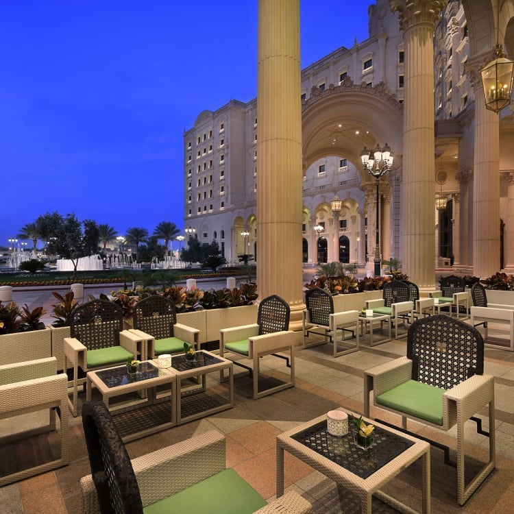 The terrace of a restaurant with trees in the back