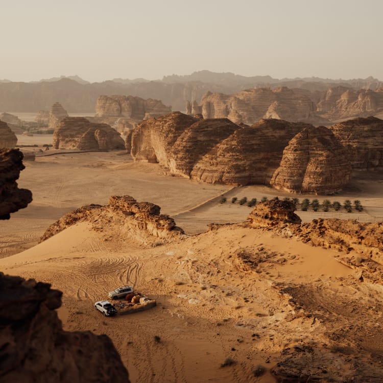 A vast desert landscape with rocky formations and sparse vegetation in Asher Tal National Park, AlUla.