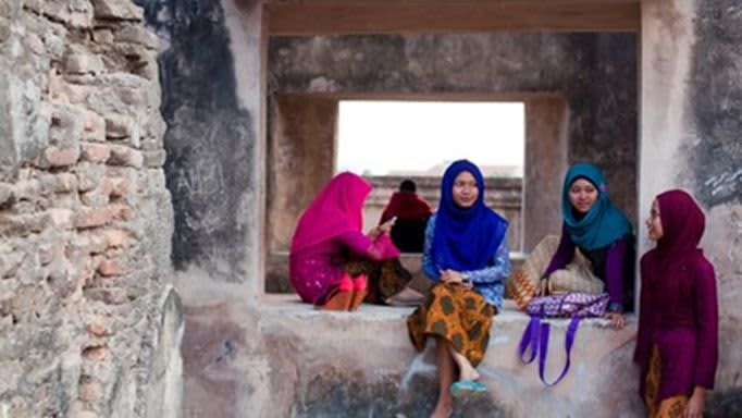 Group of four women talking
