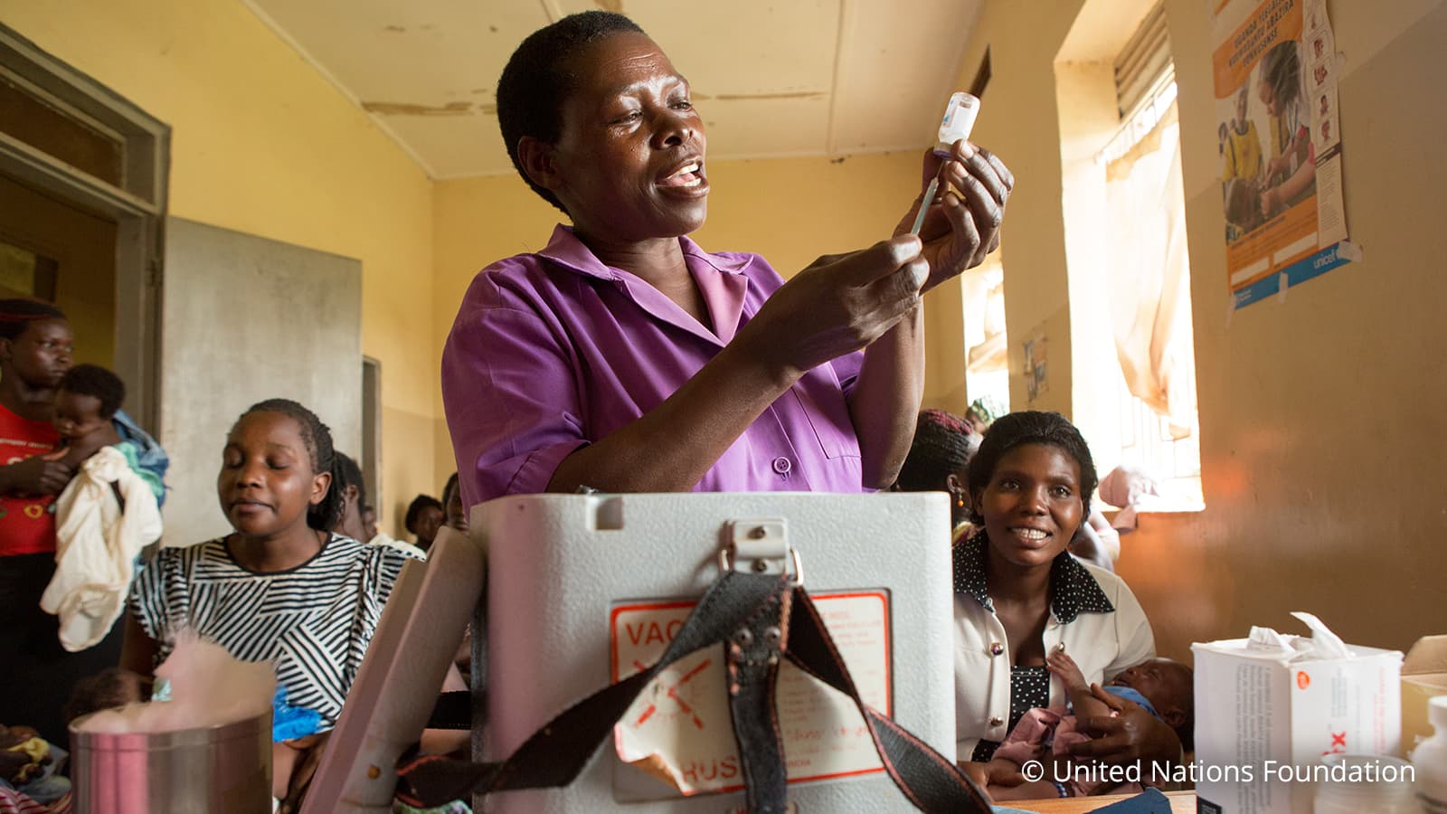 Woman prepararing dose for vaccination