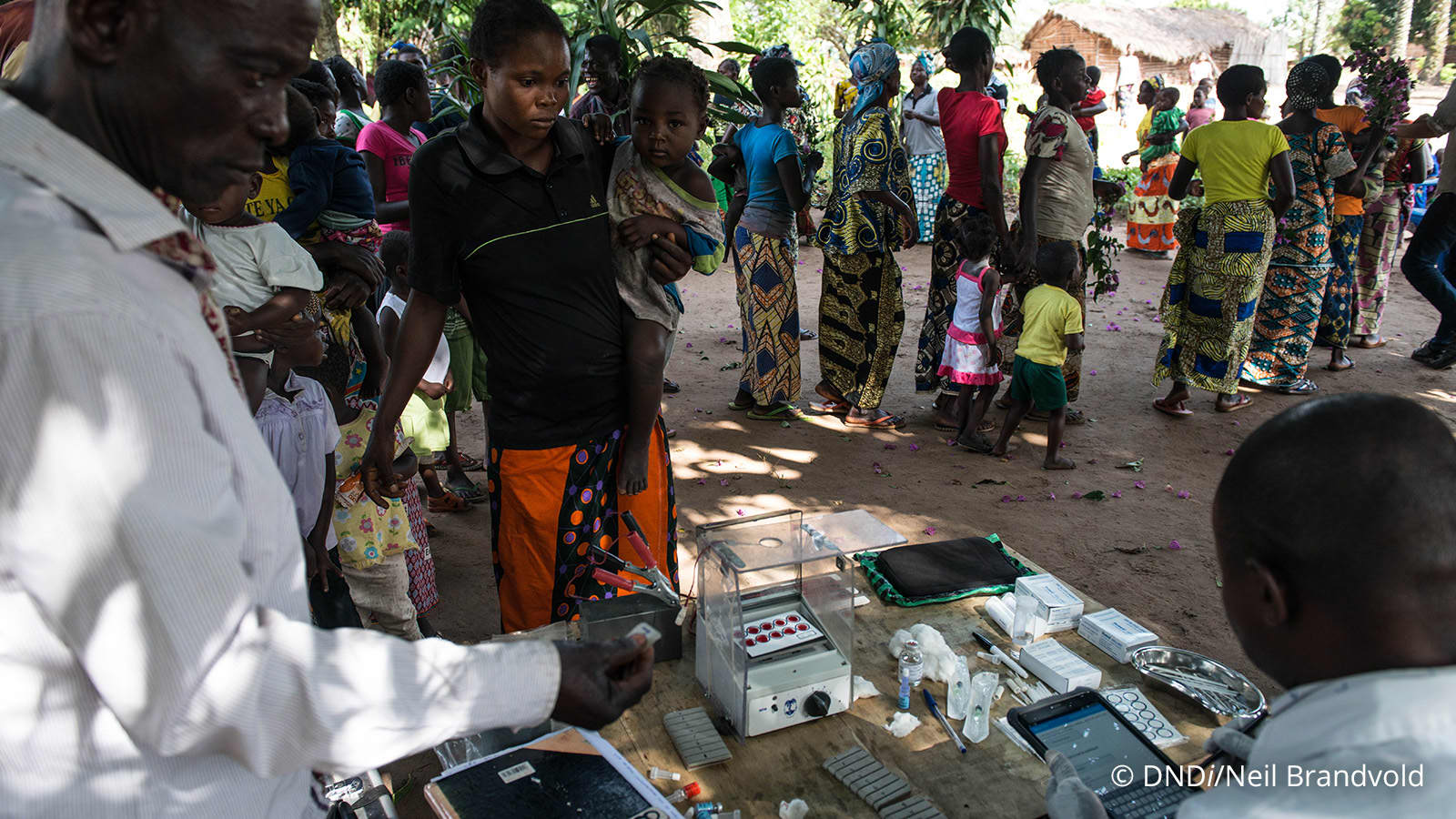 Physicians treating woman and child