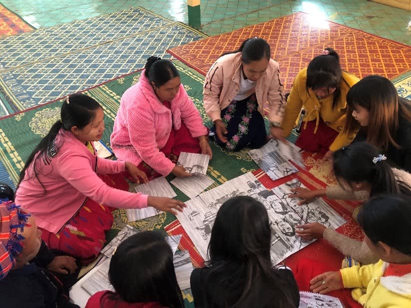 Group of women working in an activity, by uniting different parts of a larger image