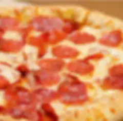 Close-up of a pizza with cheese and pepperoni