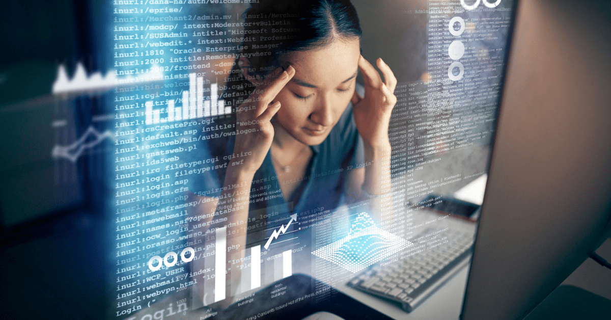 Photo of a woman sitting at a workstation with her eyes closed and fingers on her temples overlayed with graphics of code and graphs