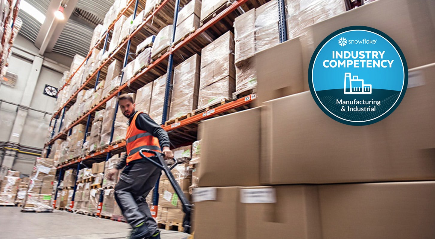 A warehouse worker in an orange safety vest moves boxes with a pallet jack. "Industry Competency: Manufacturing &amp; Industrial" badge is displayed in the top right corner.