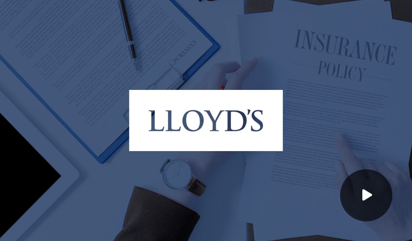 Lloyd's company logo overlayed on an image of insurance documents scattered on a desk