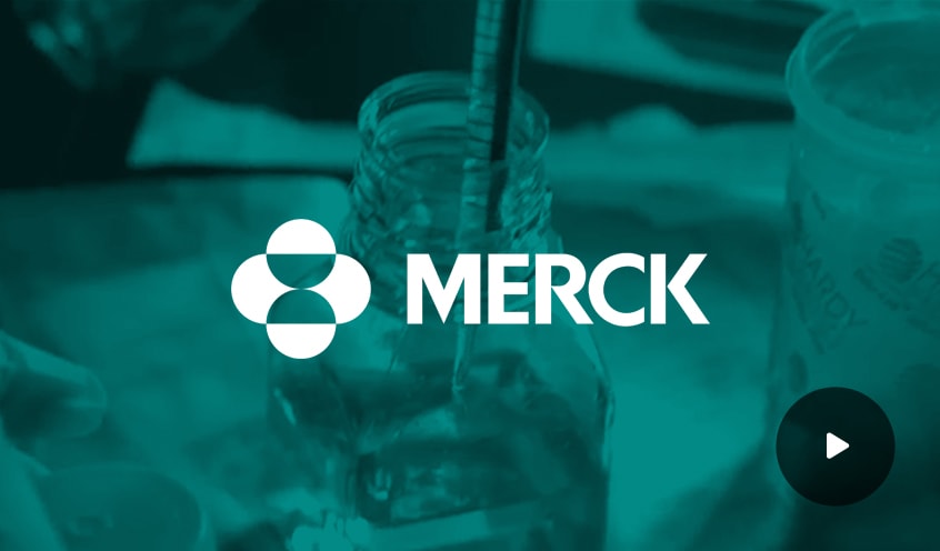 Merck company logo overlayed on an image of a syringe extracting liquid from a bottle