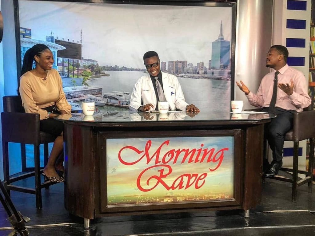 Dr. George The Talk Doctor on the set of his health TV show on Rave TV