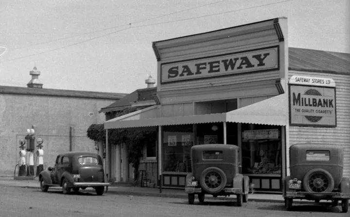 **July 1931**: Safeway opens with Wilfred Kilburn in charge. The building is owned by Frank Mitchell. It is redecorated and had a canopy put over the front. **March 1935**: Fire at back of building caused considerable damage to local Safeway store and is closed for a week. Overheated stovepipe caused the problem. **April 1939**: Fire at Safeway & Binkley buildings.