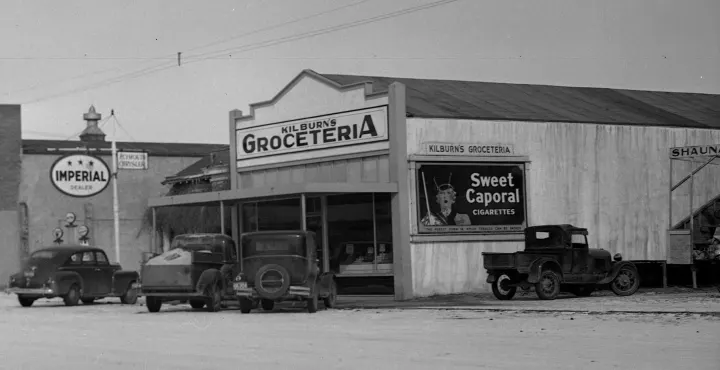 **August 1940**: Wilfred Kilburn buys out Safeway store and renames it Kilburn’s Groceteria. **February 1945**: Gerry Kilburn returns from the war and takes over from his dad.