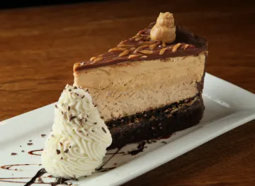 image of REESE PEANUT BUTTER CHOCOLATE CAKE CHEESECAKE