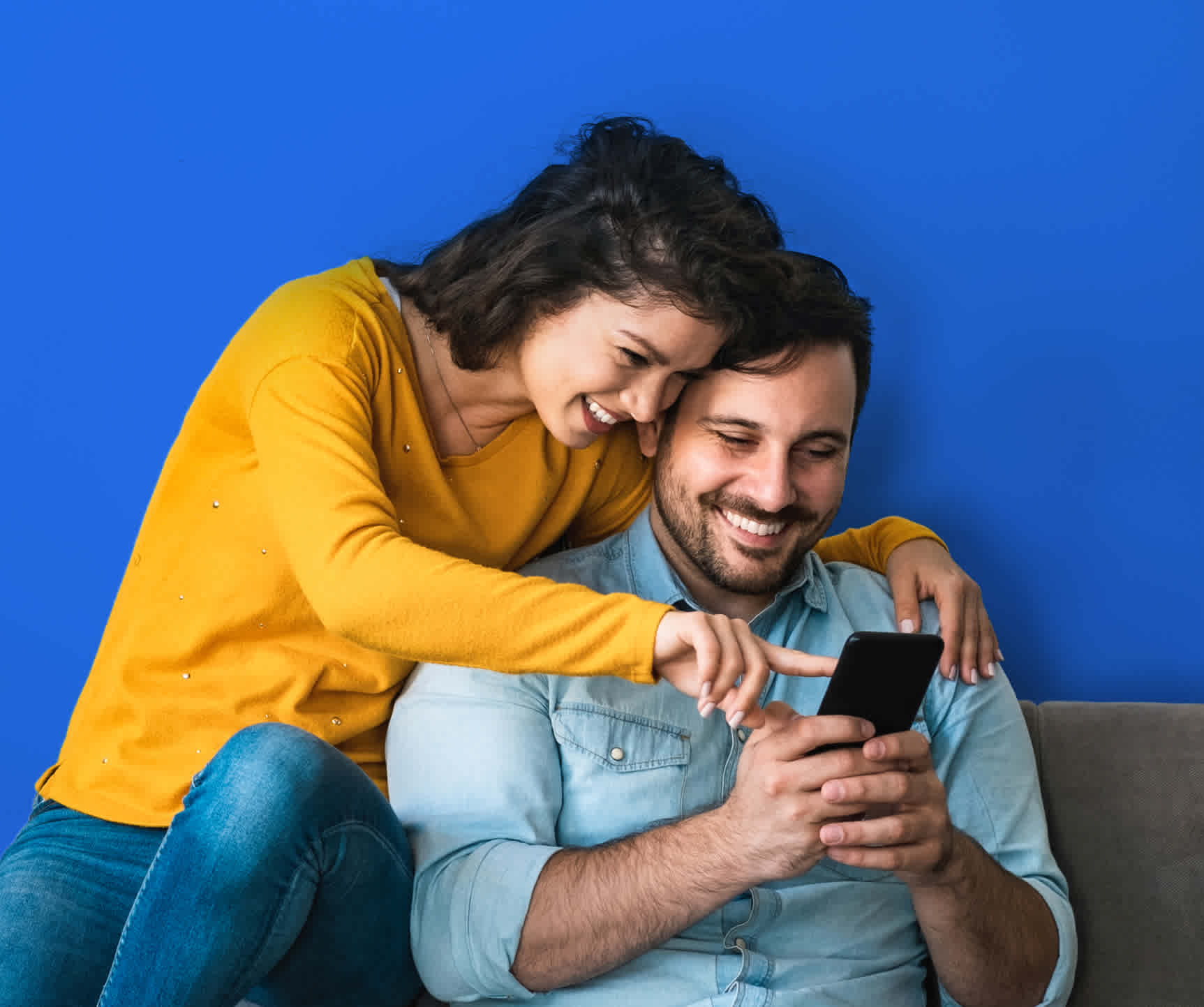 A couple looking at a phone