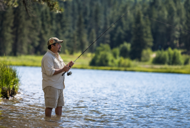 Man fishing at an Angel Fire lake