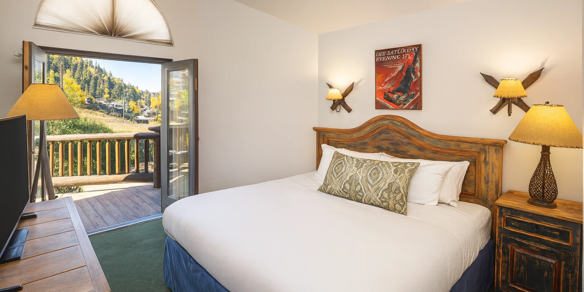 One Bedroom Loft with balcony doors open to the mountain