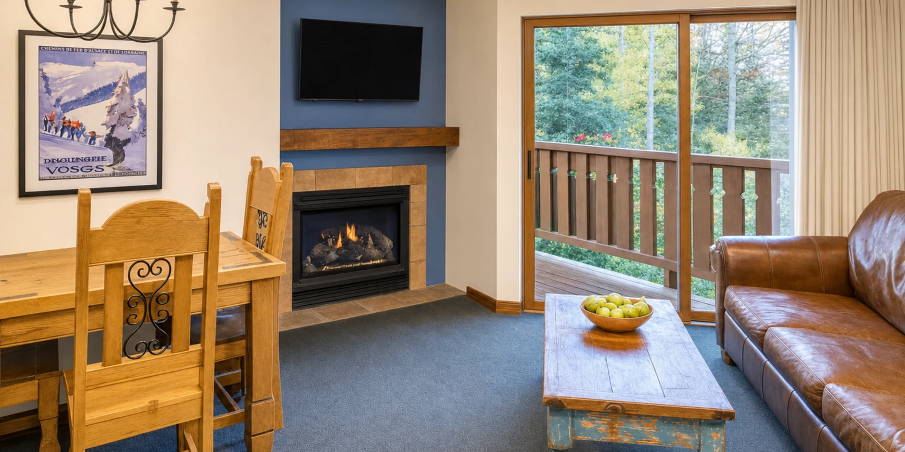 One Bedroom Suite living area with fireplace and mountain view