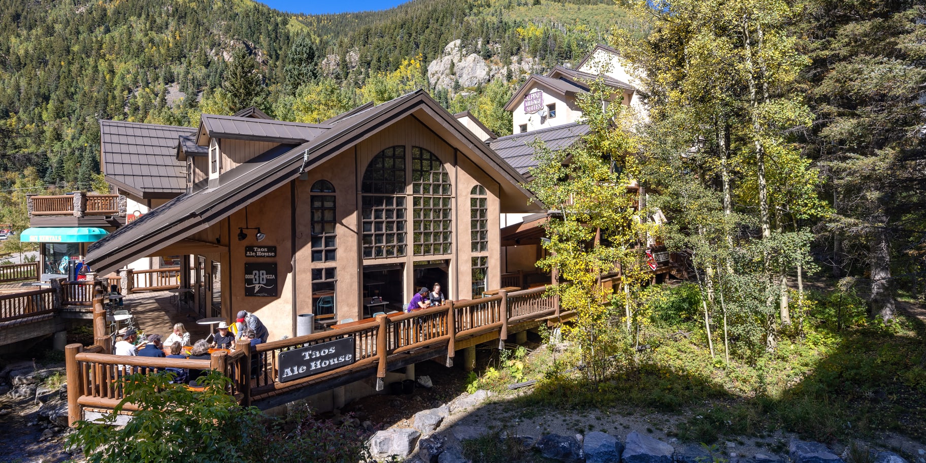 Alpine Village Suites Summer exterior