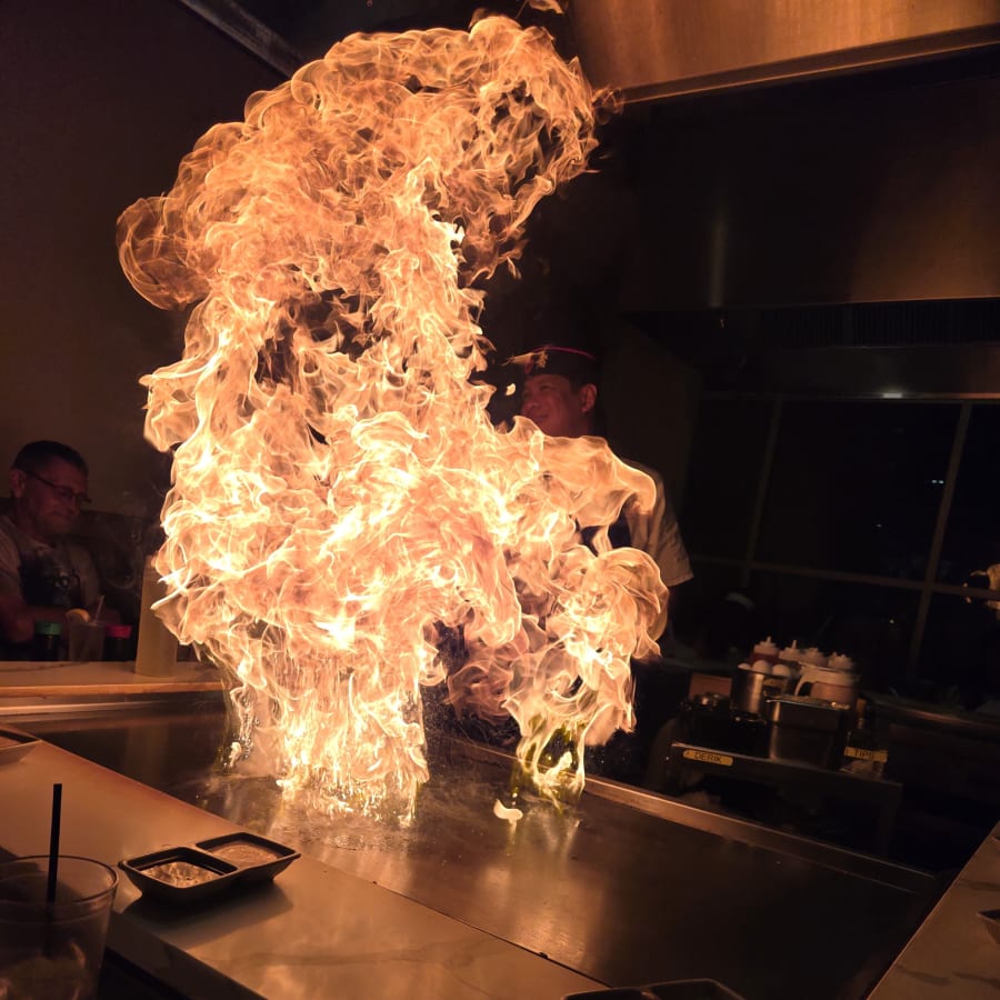 A burst of flame off the hibachi grill