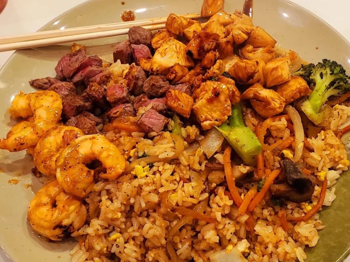 A hibachi plate of steak, chicken and fried rice