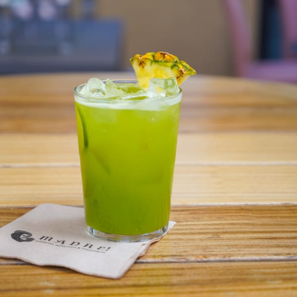 Cucumber pineapple agua fresca in a tall glass
