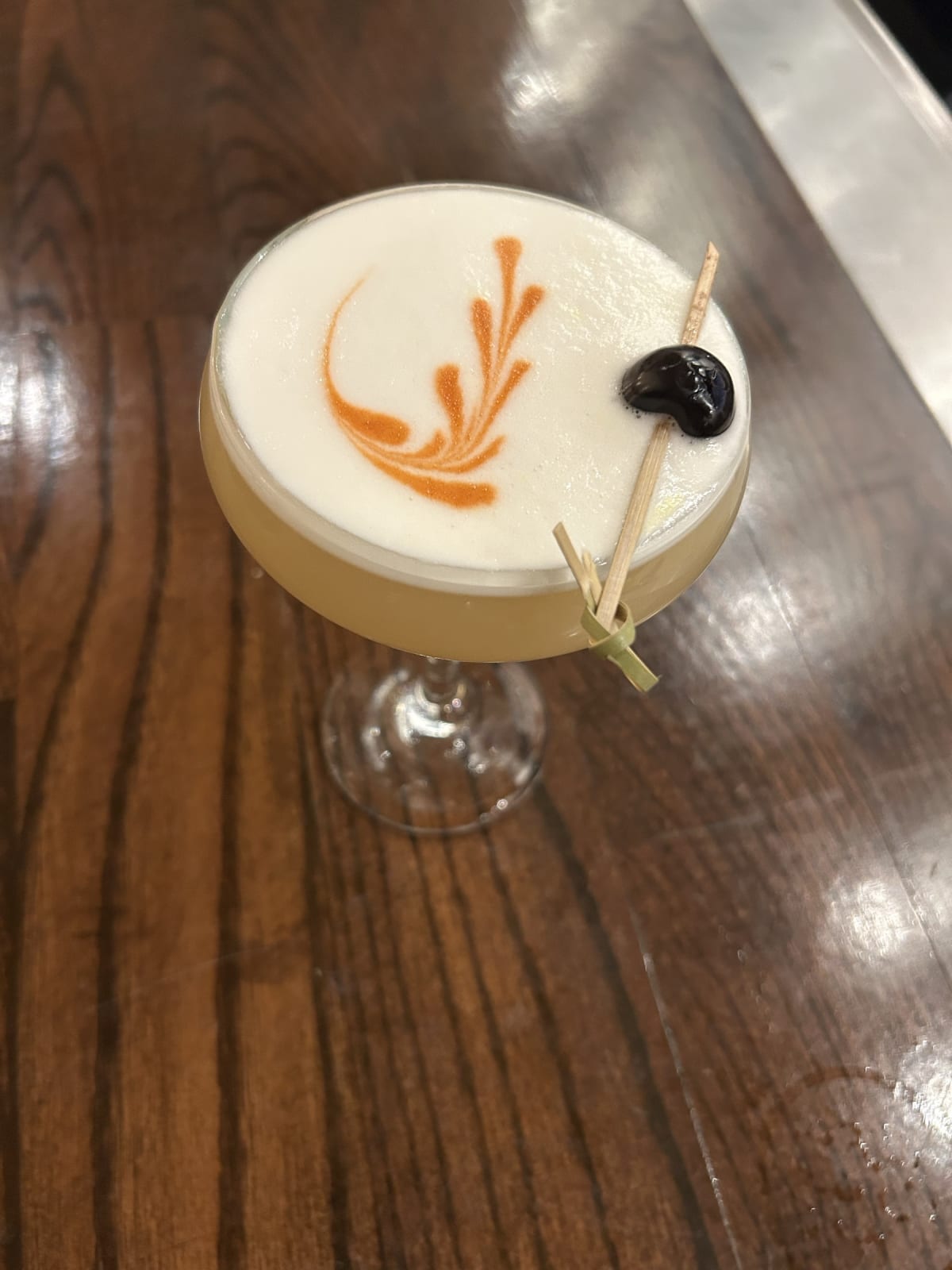Don't Be Sour Signore — house cocktail with a fern-etched foam top