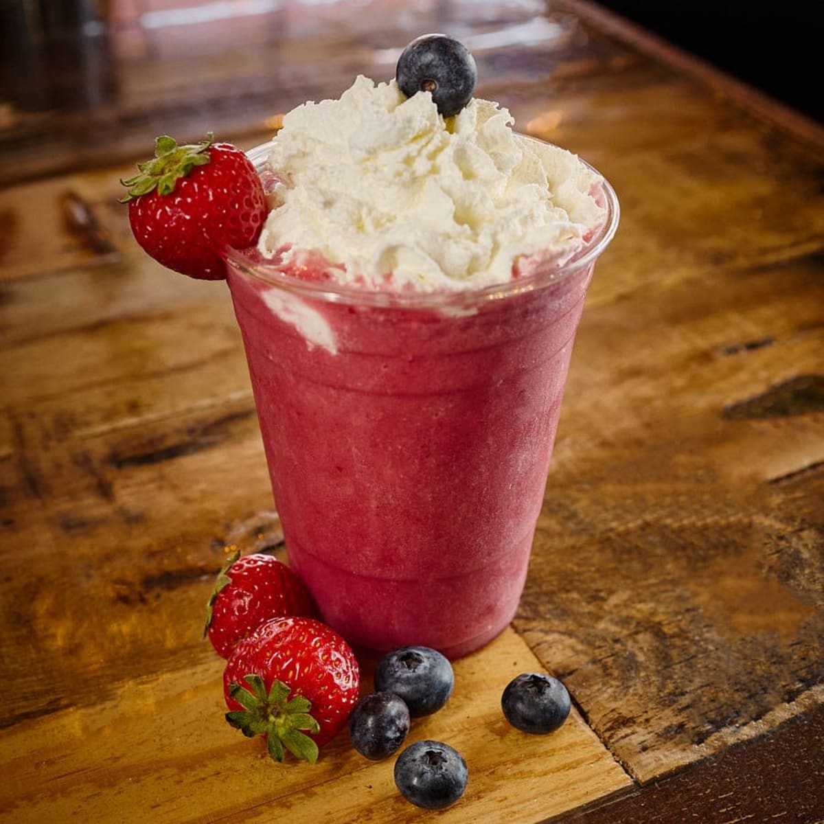 A berry blast smoothie with fresh strawberries and blueberries