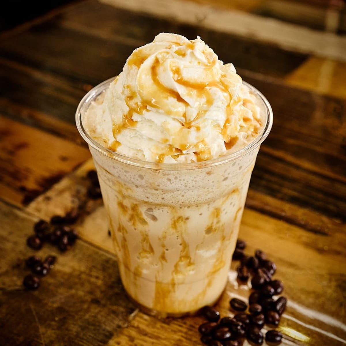 A blended caramel macchiato topped with whipped cream and caramel