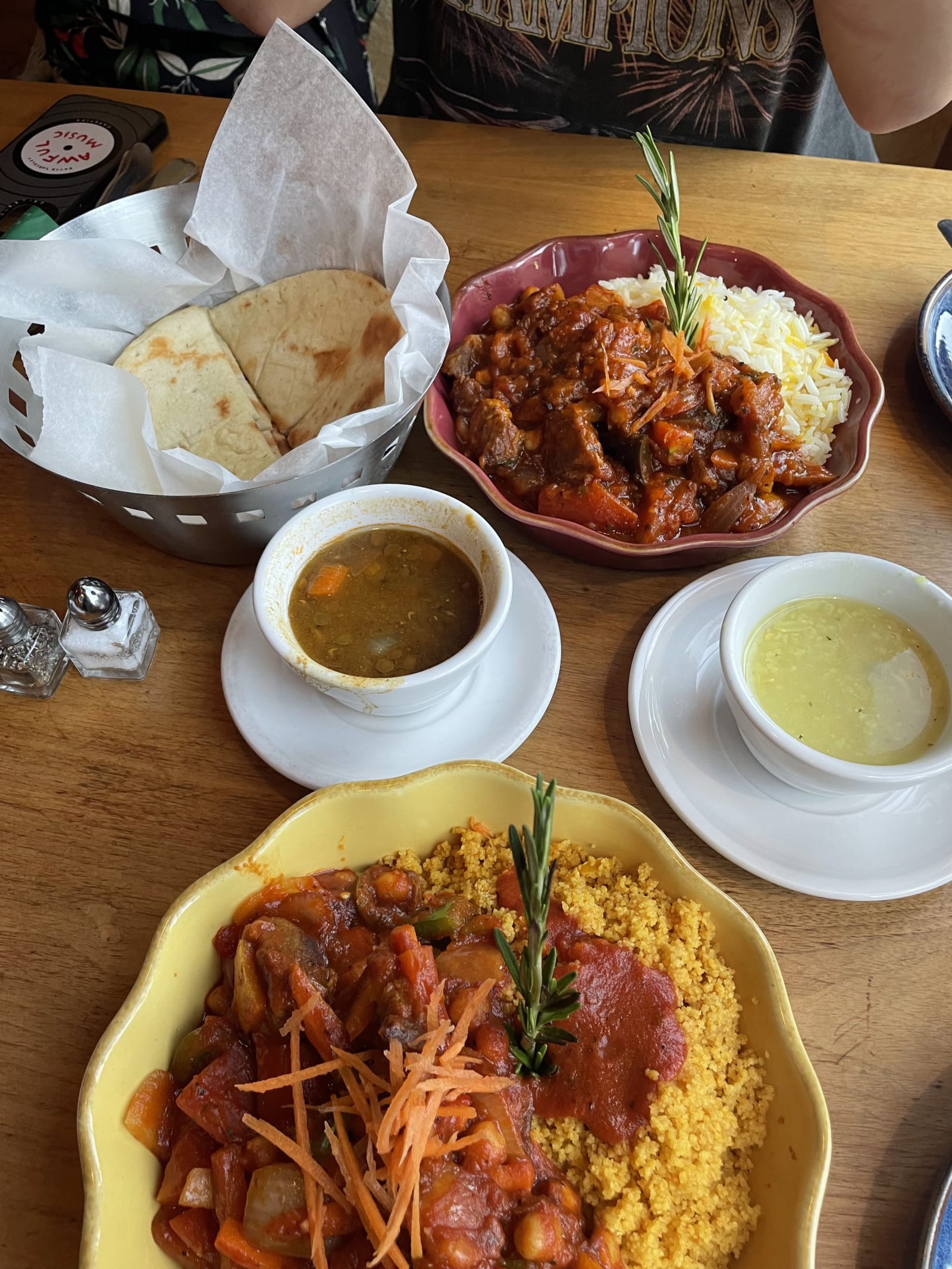A shared table of Mediterranean plates at Andie's