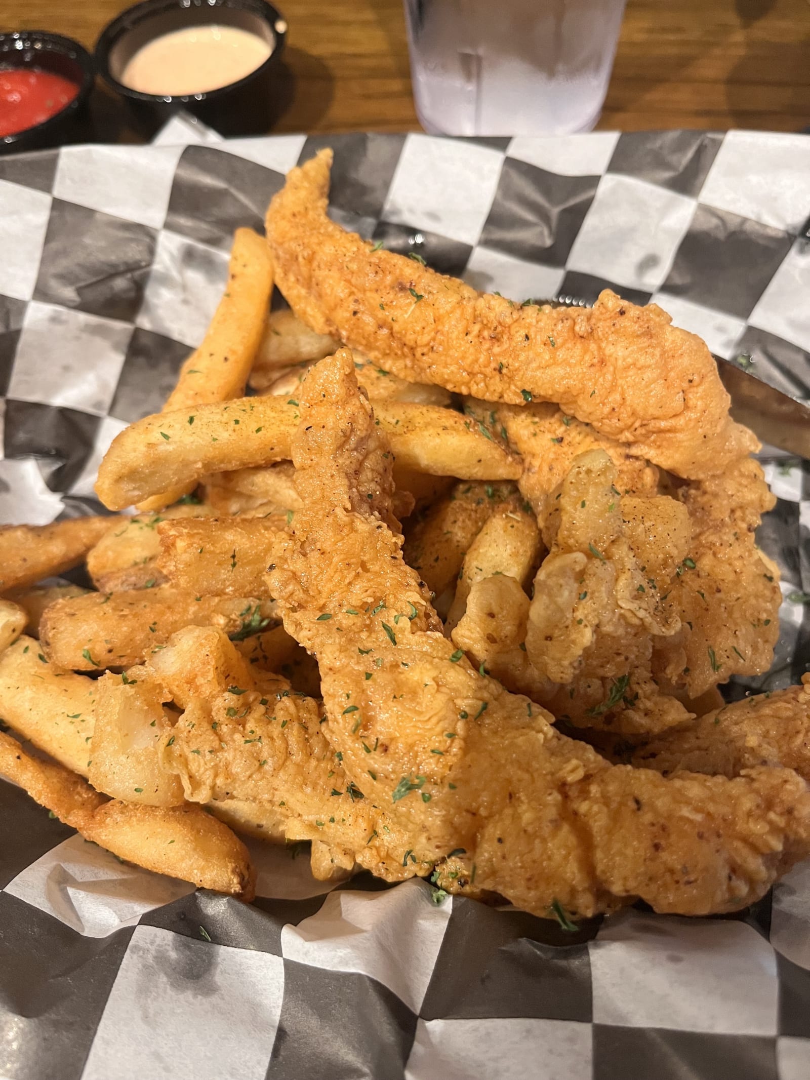 A basket of fried catfish tenders and fries