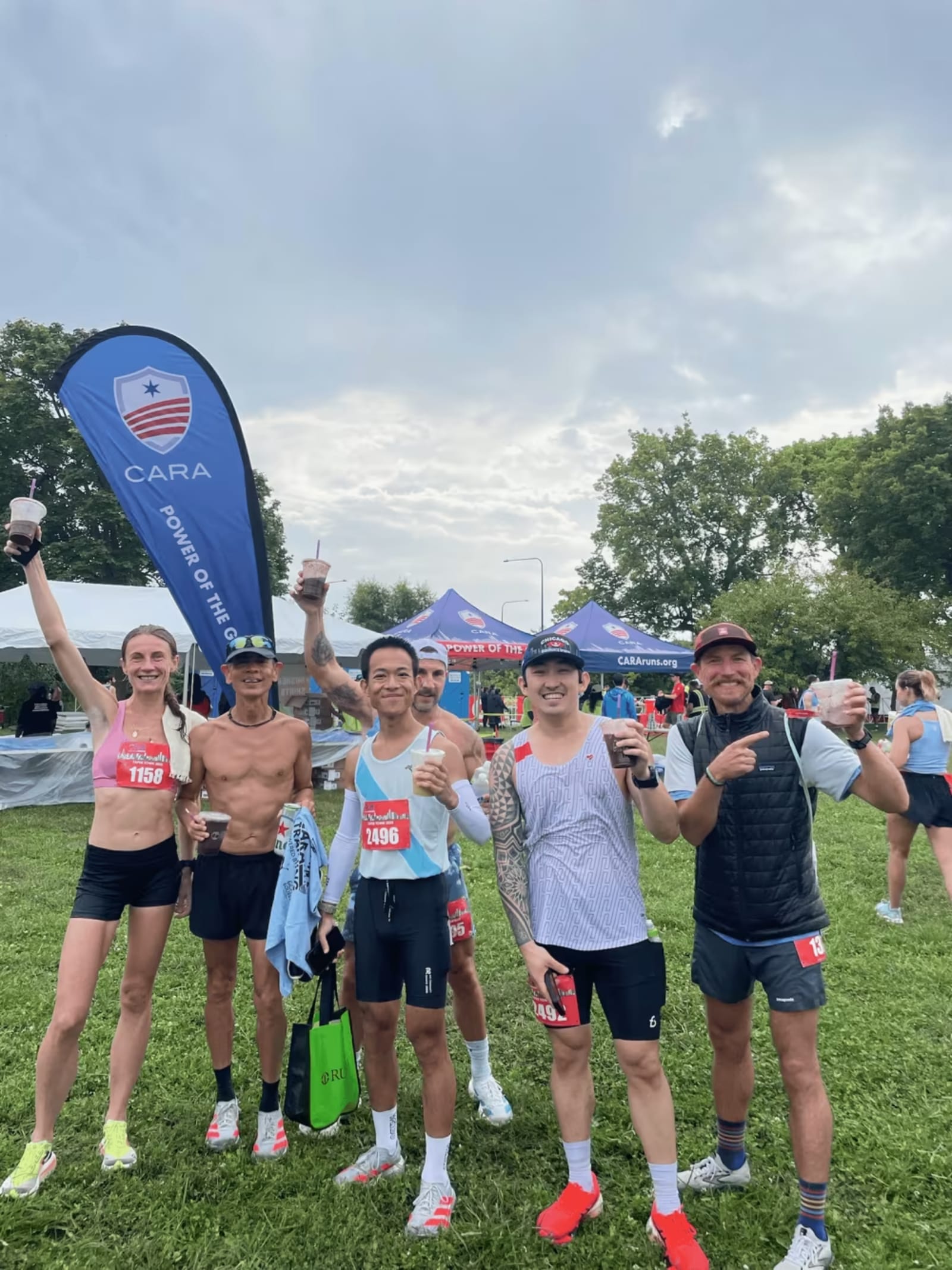 Runners raising Deep Purpl açaí cups after a Chicago race