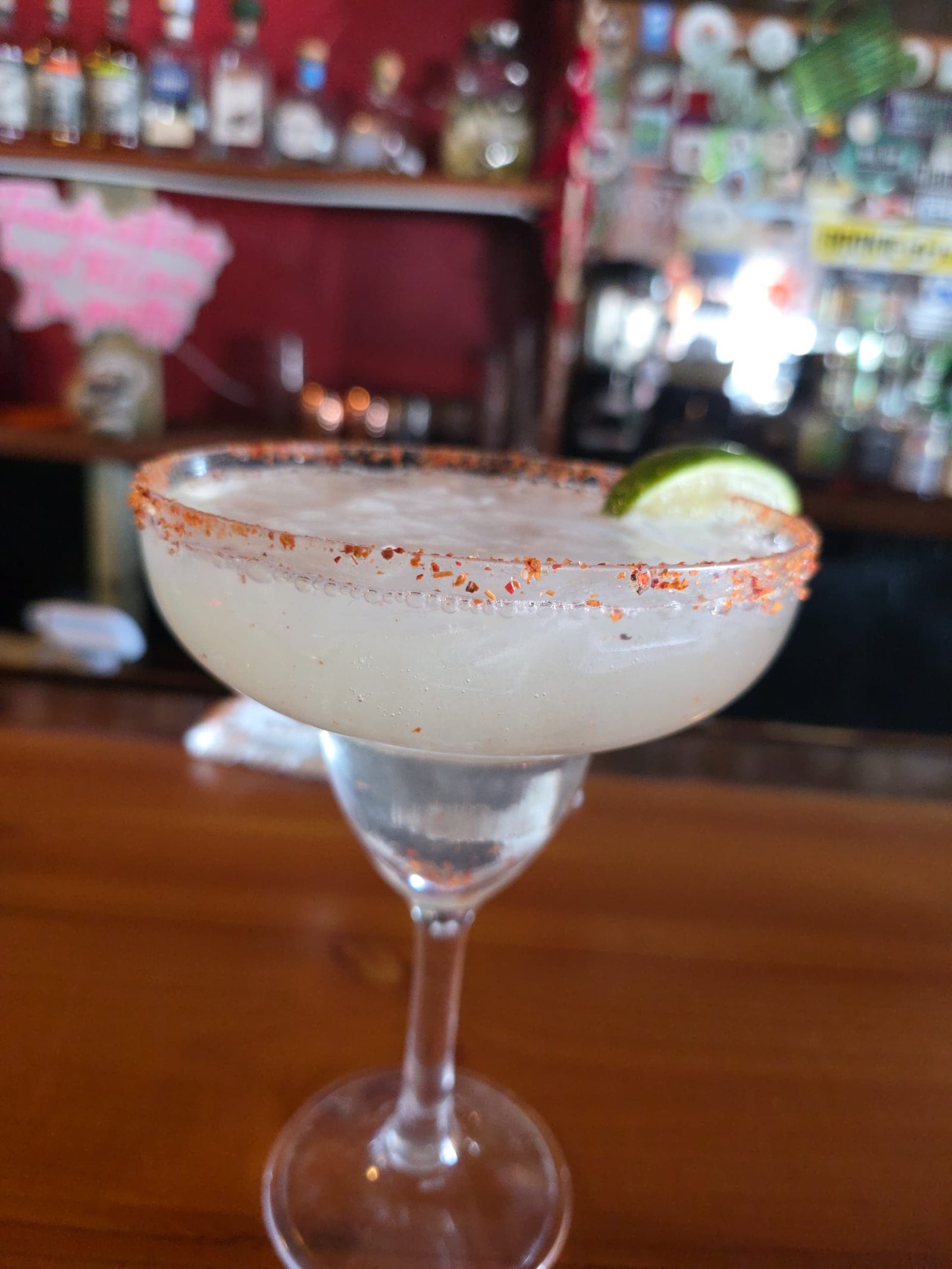 House margarita with a chile-salt rim on the bar at Mother's Cantina
