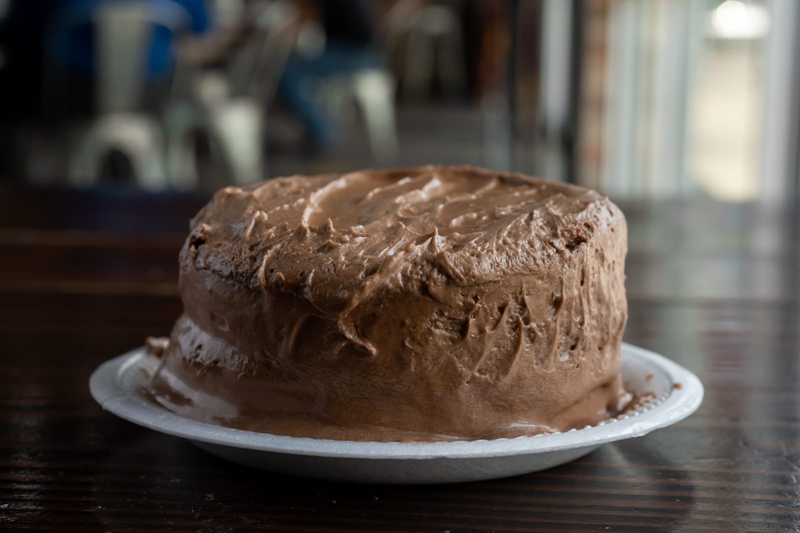A homemade chocolate layer cake on a plate