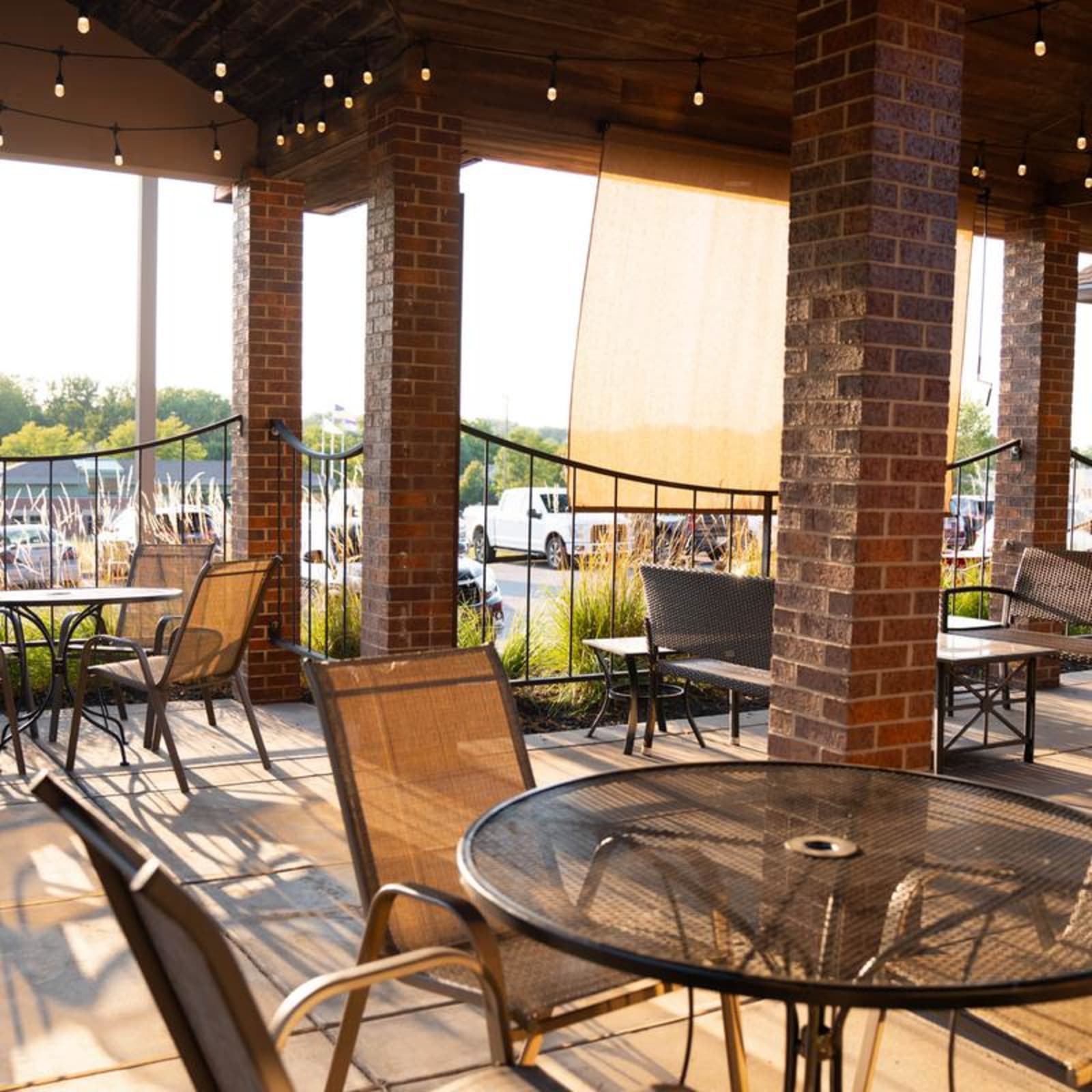 The covered patio under string lights