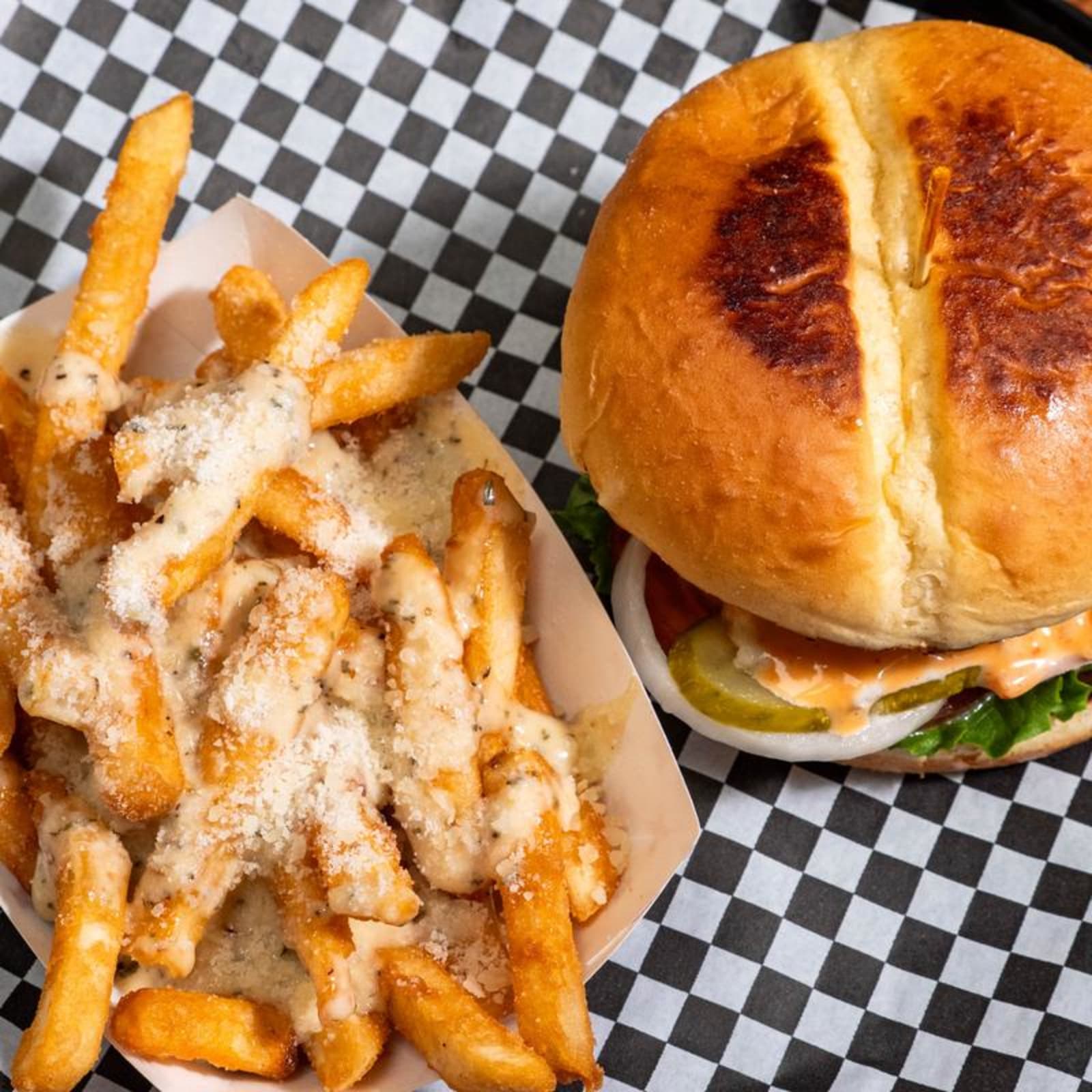 A crispy chicken sandwich with garlic parmesan fries