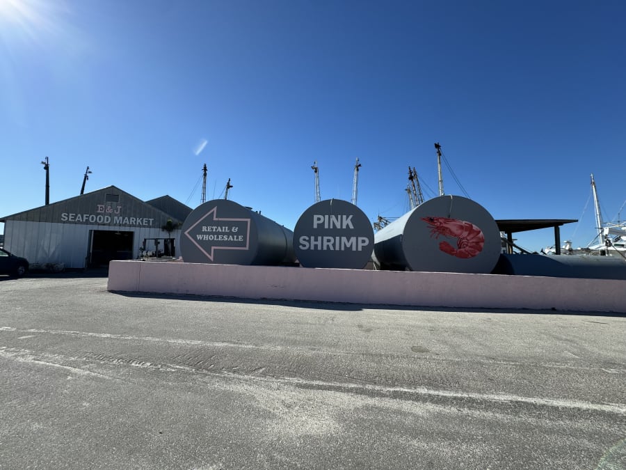 The E&J Seafood Market and painted PINK SHRIMP tanks at the dock