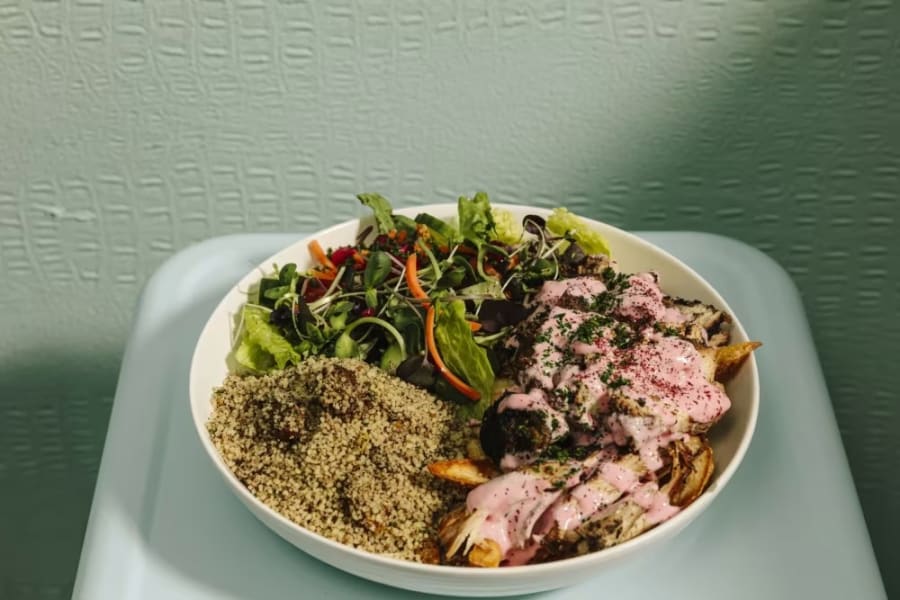 A shawarma bowl with quinoa and greens