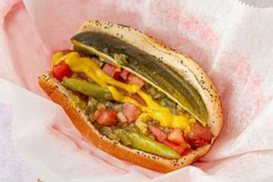 A Chicago-style hot dog on a poppy-seed bun