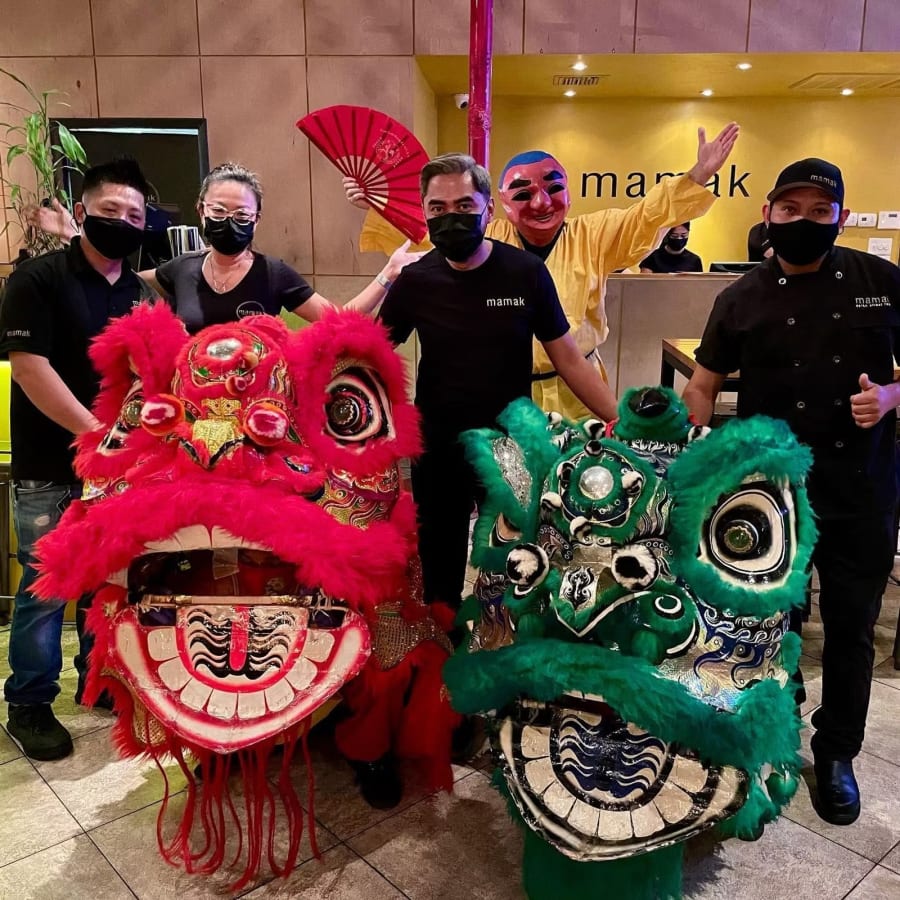 Lion dancers and the Mamak team at Lunar New Year