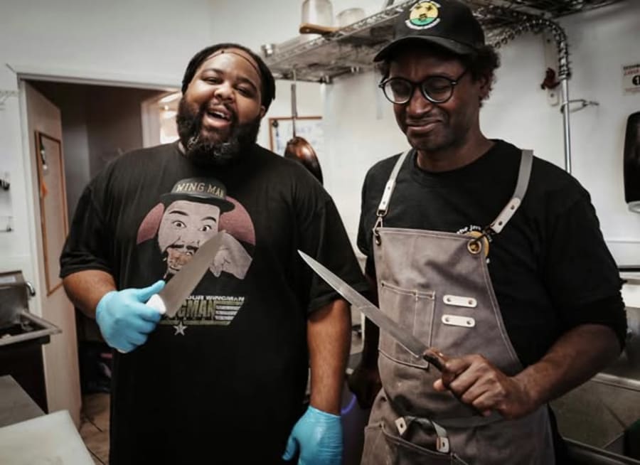 Two cooks in the Jerk Grill kitchen