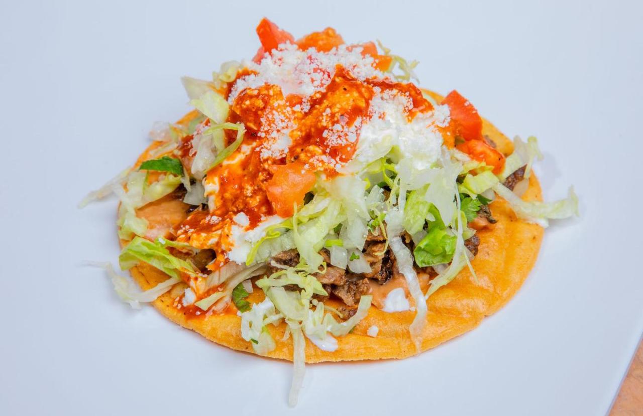 Loaded nachos with guacamole and sour cream in the dining room