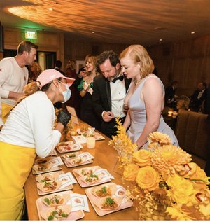 Corporate team gathered for a Chicas Tacos catered meal