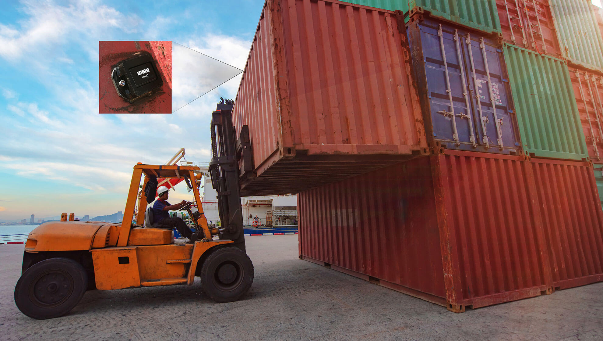 Forklift moving a shipping container fitted with ESCO Track GPS cellular tracking device