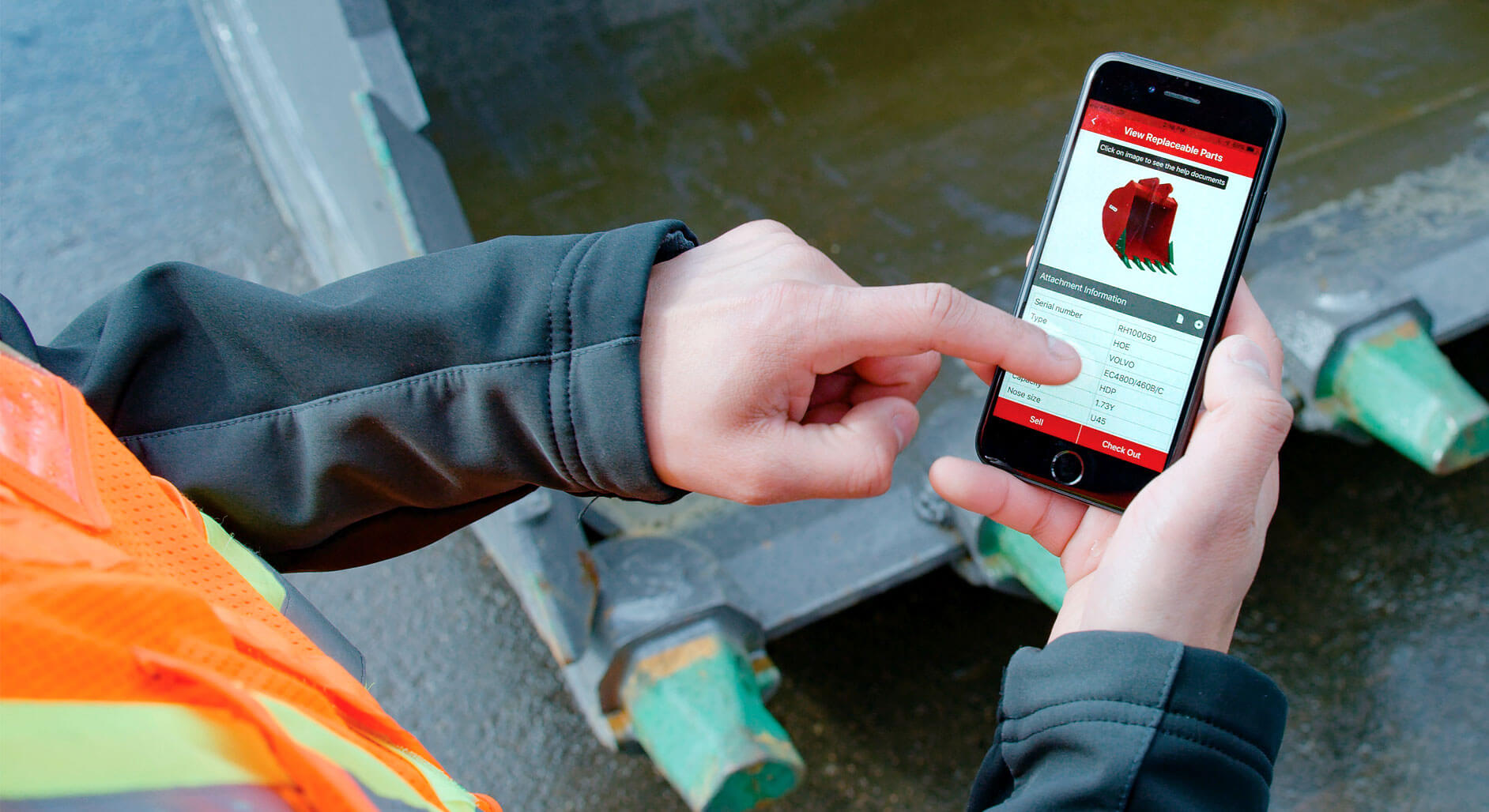 Worker identifying replacement part numbers using ESCO Track asset tracking smartphone app